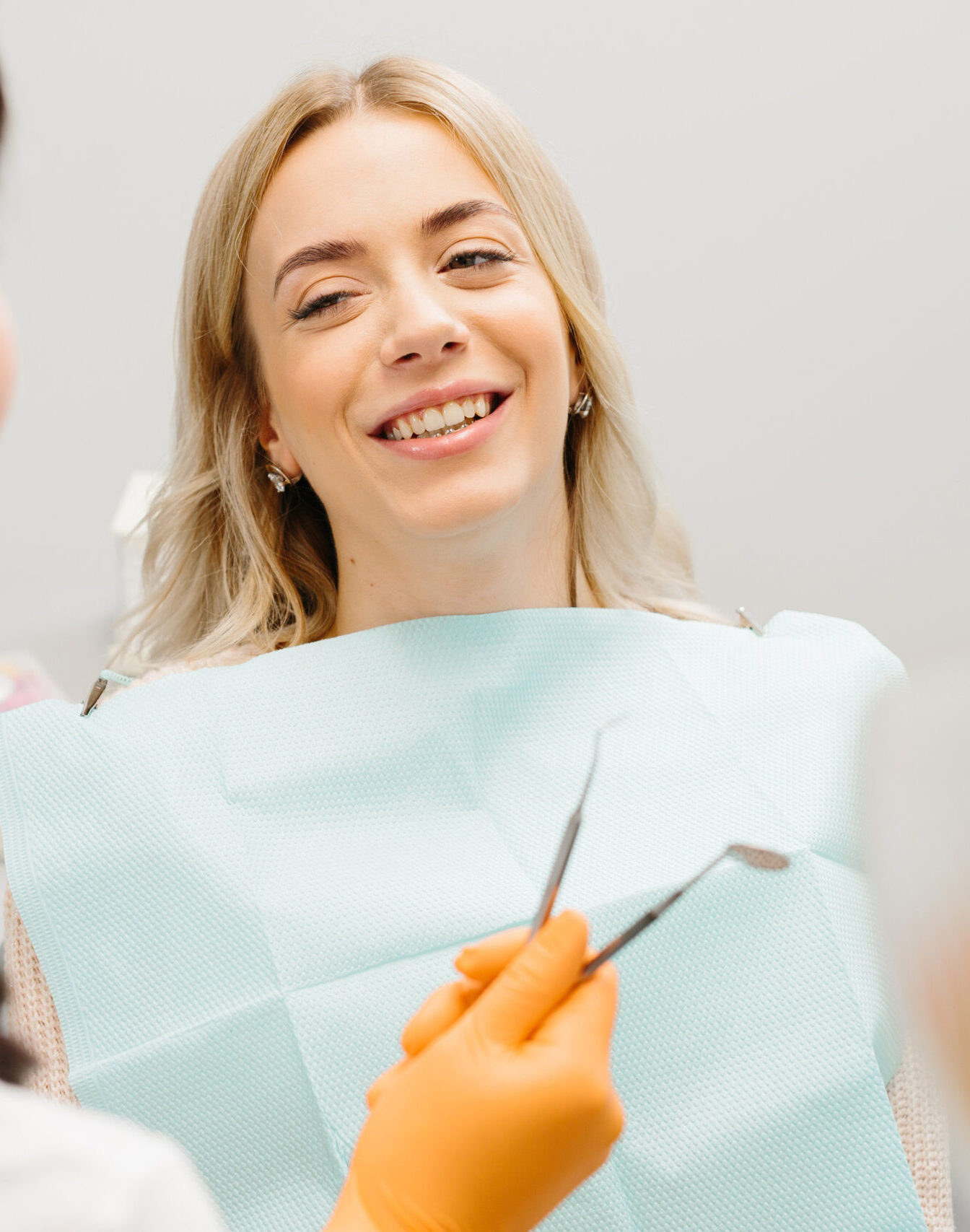 Doctor talking with her patient. Dentist concept