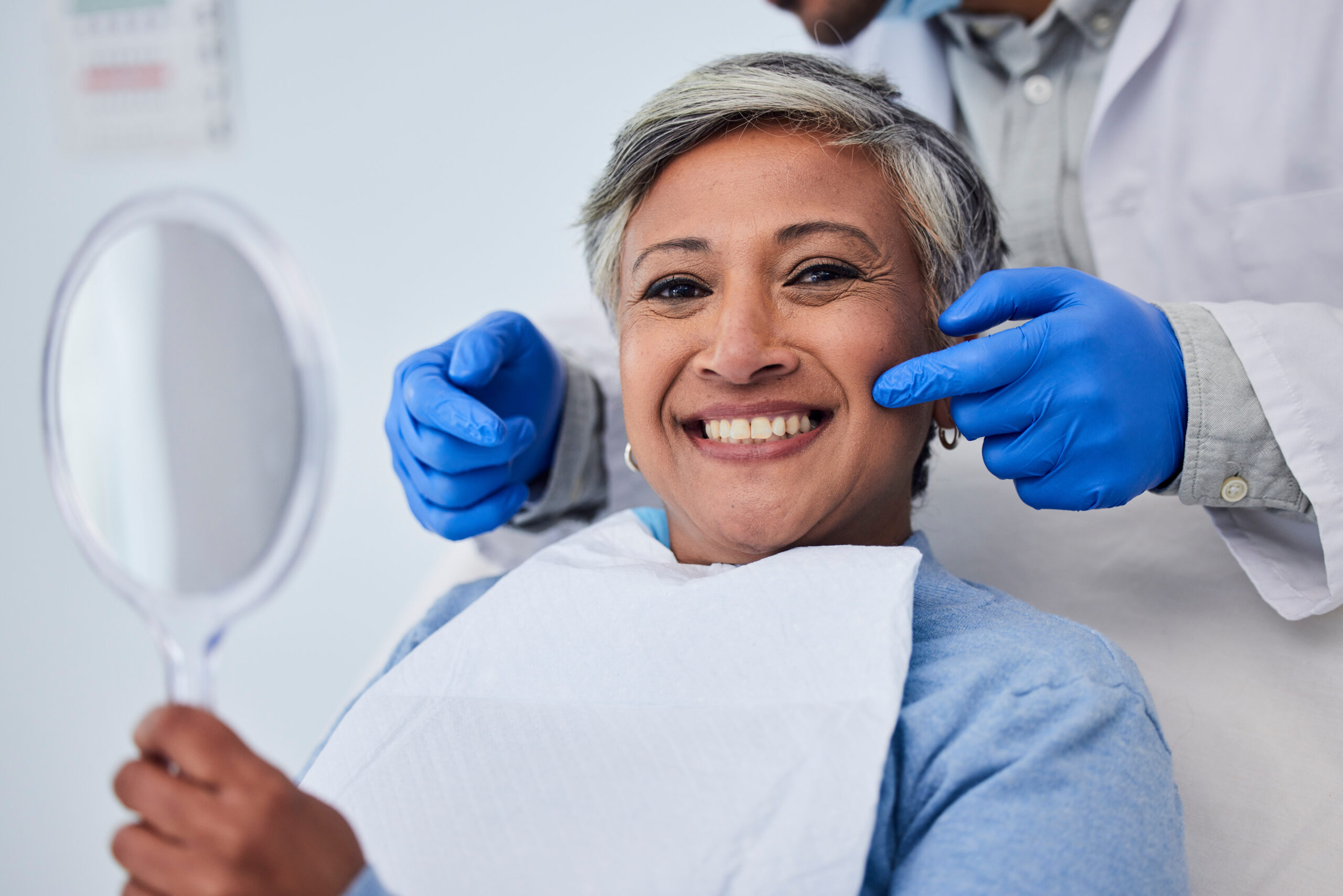 Happy senior woman, teeth and dentist for dental care, appointment or checkup at clinic. Portrait of elderly female person smile for tooth whitening, cleaning or oral, mouth and gum care at hospital.