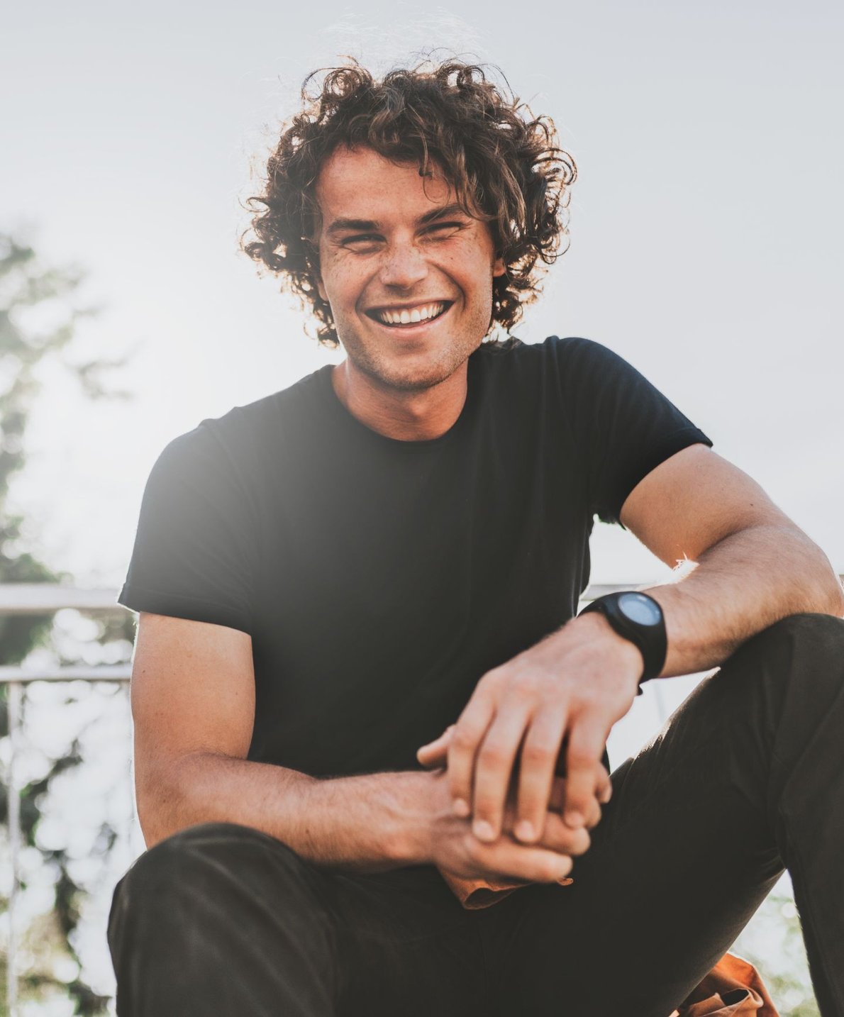 Smiling man with a confident smile, representing porcelain veneers